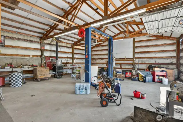 Note the nice above ground car lift and floor car lift included