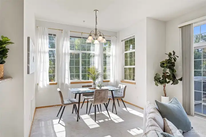 Spacious dining area surrounded by natural light.