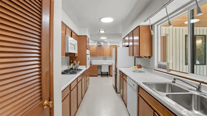 Functional galley kitchen with plenty of cabinetry and workspace.