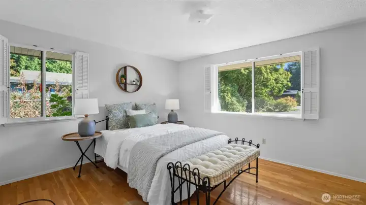 Retreat to this airy & spacious primary suite offering all the comfort & charm you could wish for!