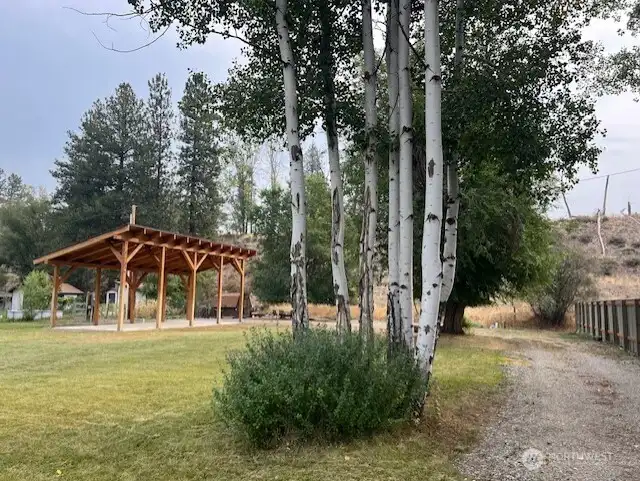 Welcome to your peaceful retreat, framed by aspens and mature trees.