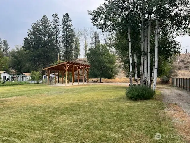 Driveway access leads directly to the RV pad and open space.