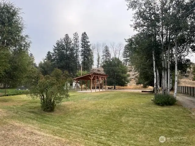 Expansive yard offers plenty of room for yard games, pets, and gardening.