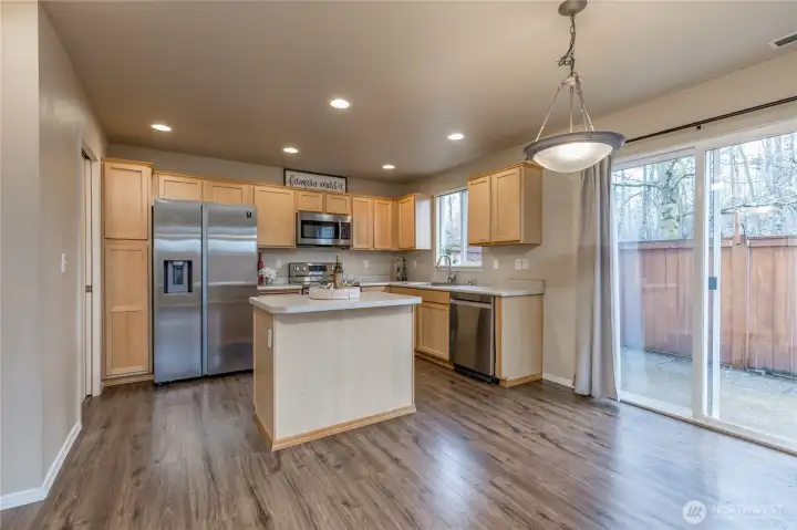 Dining area has slider to your private, fully-fenced yard