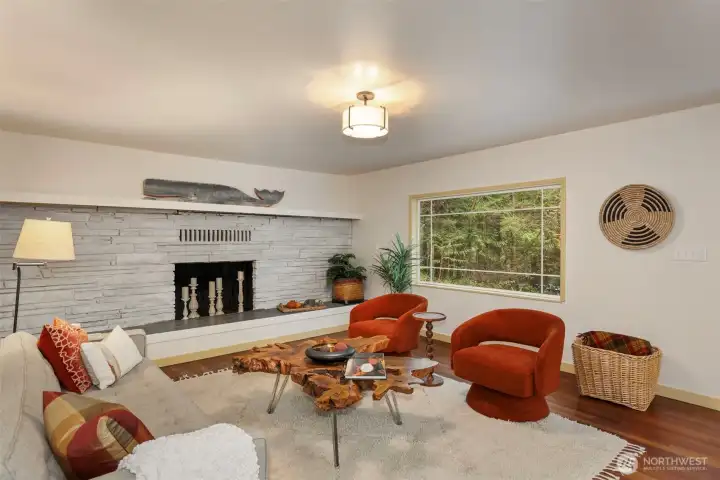 Great big stone fireplace with a mantel begging for holiday decorations.