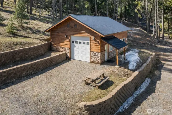 Elevated view of cabin with expansive outdoor space and natural surroundings.