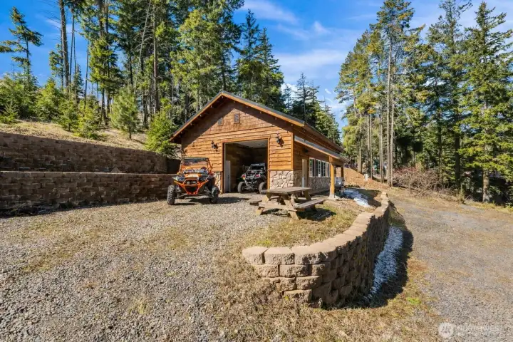 Rustic cabin and garage combo offering privacy, space, and mountain lifestyle living.