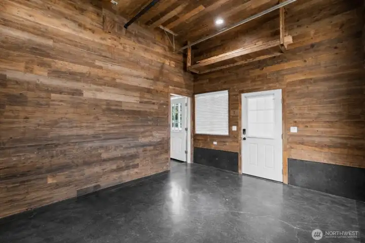 Finished garage space ideal for off-road vehicles, snowmobiles, or workshop setup.