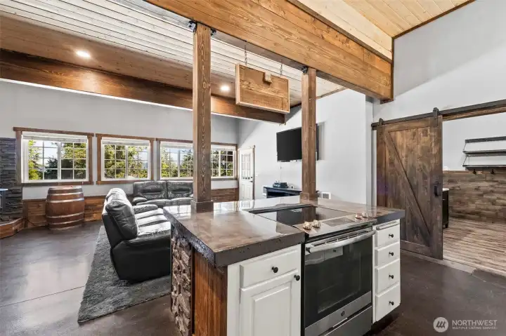 Kitchen with island overlooking living space, ideal for hosting and everyday living.
