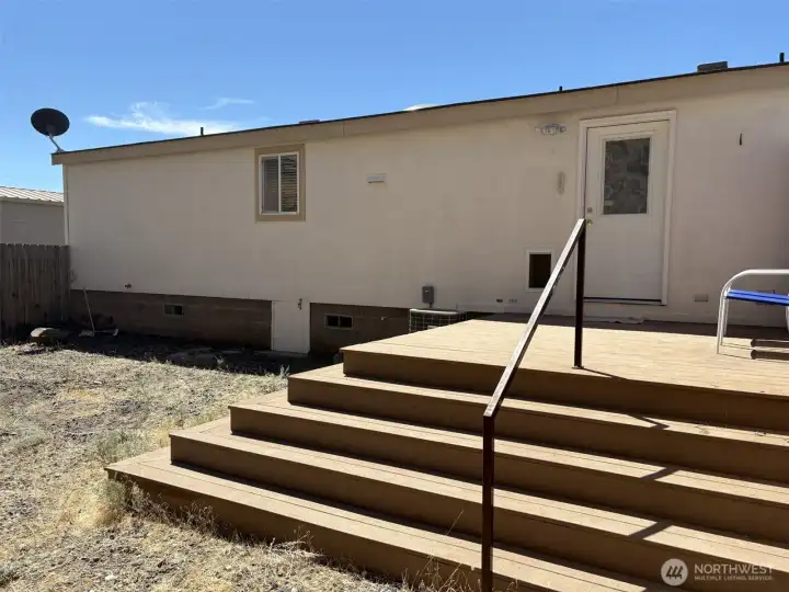 Back yard Trex deck and fenced yard.
