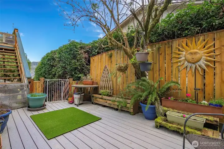 Another private patio located off the lower downstair family room adds an artistic gardener's flair.