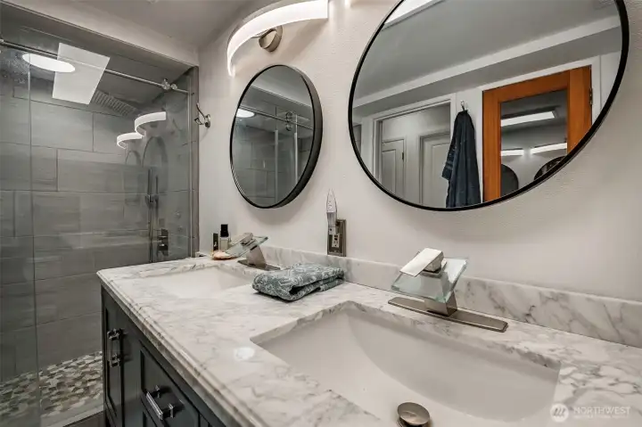 Newlyupdated lower downstairs bathroom with view of shower.