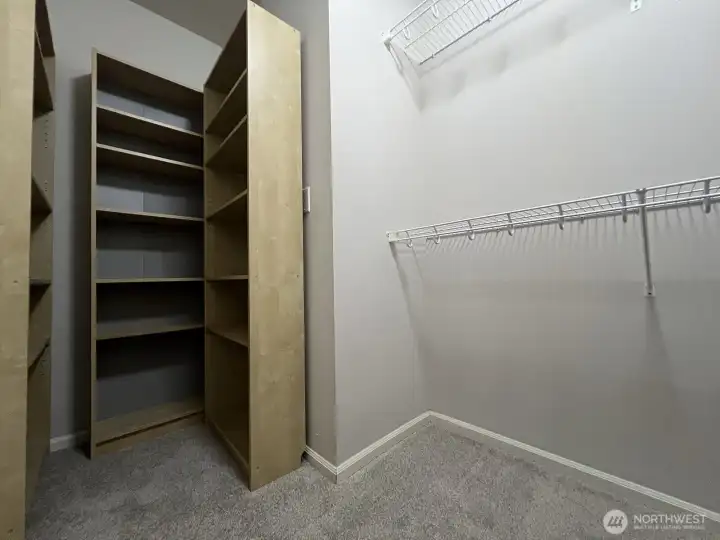 Primary bedroom walk-in closet