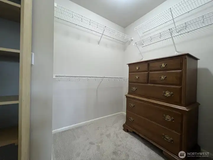Primary bedroom walk-in closet