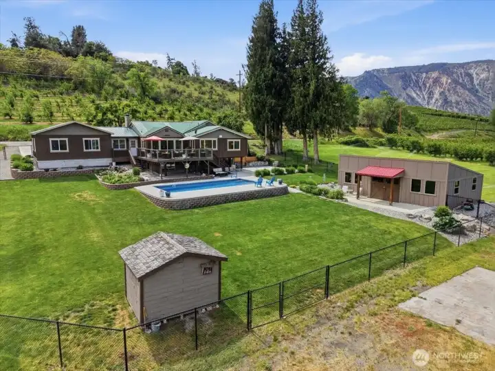 Drone photo of exterior setting and 1/2 an acre fully fenced