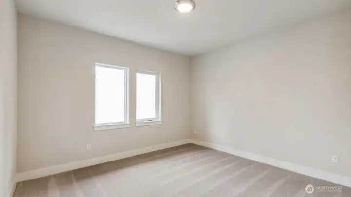 Main floor bedroom. Photos are for representation only.  Features, colors and selections may differ from photograph. See site agent for details.