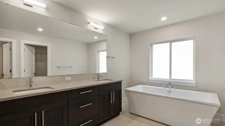 Primary Bathroom Soaking Tub. Photos are for representation only.  Features, colors and selections may differ from photograph. See site agent for details.