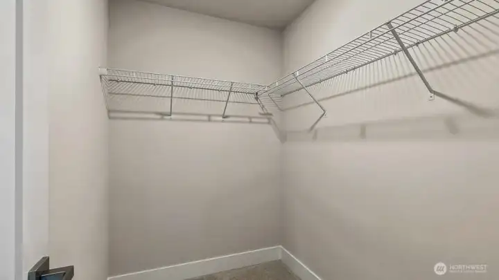 Bedroom's walk in closet. Photos are for representation only.  Features, colors and selections may differ from photograph. See site agent for details.