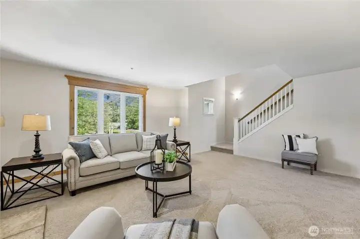 Stairs to the primary bedroom suite & office/sitting room with a walk in closet too!