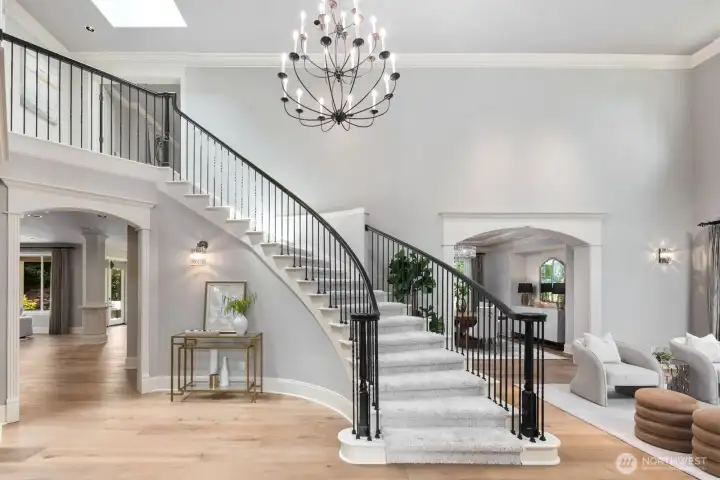 Elegant, curved staircase and gorgeous hardwood floors create a striking first impression. Chandelier lift for easy cleaning! Elegant, curved staircase and gorgeous hardwood floors create a striking first impression. Chandelier lift for easy cleaning!