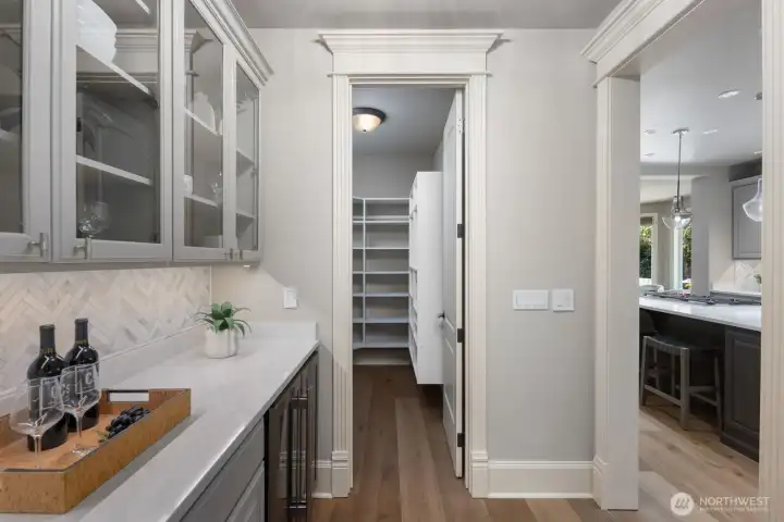 Butler’s pantry with beverage center adds convenience for effortless entertaining. Butler’s pantry with beverage center adds convenience for effortless entertaining.