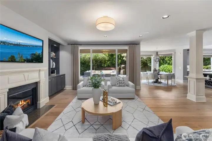 Warm and inviting great room is centered around a gas fireplace with custom built-ins. Warm and inviting great room is centered around a gas fireplace with custom built-ins.