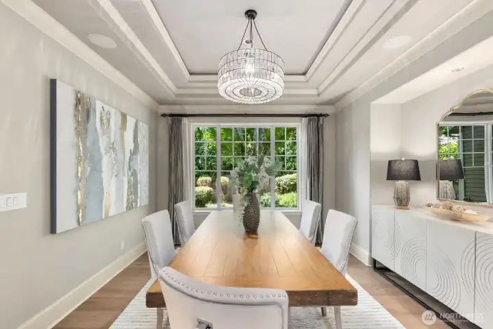 Architectural ceiling detail and a custom console niche add depth and dimension designed for both every day and elevated gatherings. Architectural ceiling detail and a custom console niche add depth and dimension designed for both every day and elevated gatherings.