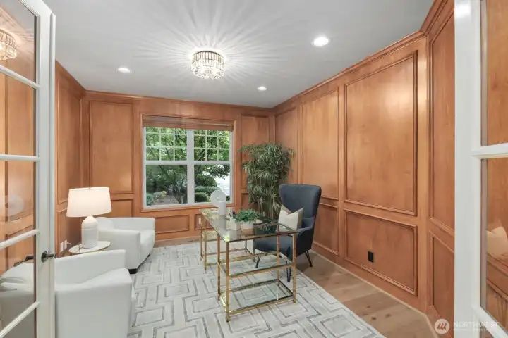 Refined office space featuring classic wall molding detail and French doors for privacy. Refined office space featuring classic wall molding detail and French doors for privacy.