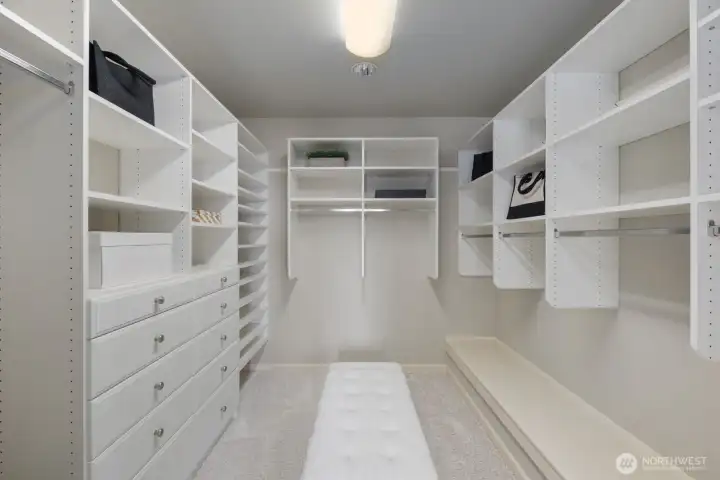 Expansive walk-in closet with thoughtfully designed storage. Expansive walk-in closet with thoughtfully designed storage.
