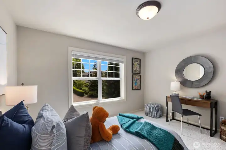 Picture windows and plush carpeting anchor secondary bedrooms overlooking the front exterior. Picture windows and plush carpeting anchor secondary bedrooms overlooking the front exterior.