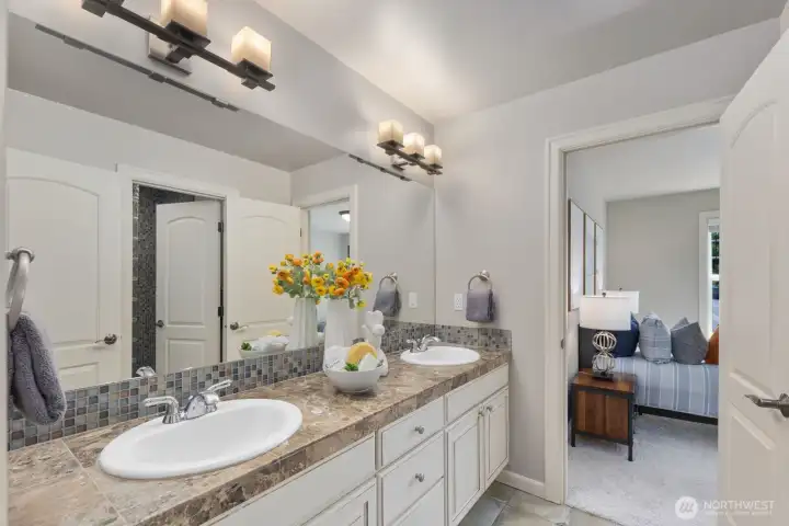 Dual-access bath connecting to both bedroom and hallway for added convenience. Dual-access bath connecting to both bedroom and hallway for added convenience.