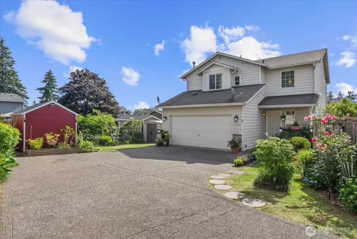 Large two-car garage featuring ample space for storage.