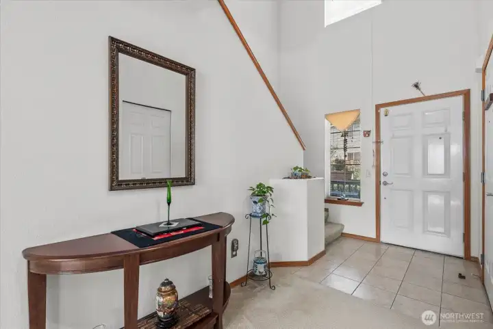 Front entry featuring high ceilings that create an open and spacious atmosphere.