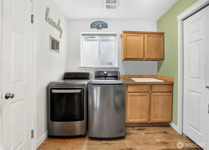 Laundry room with sink and closet Laundry room with sink and closet