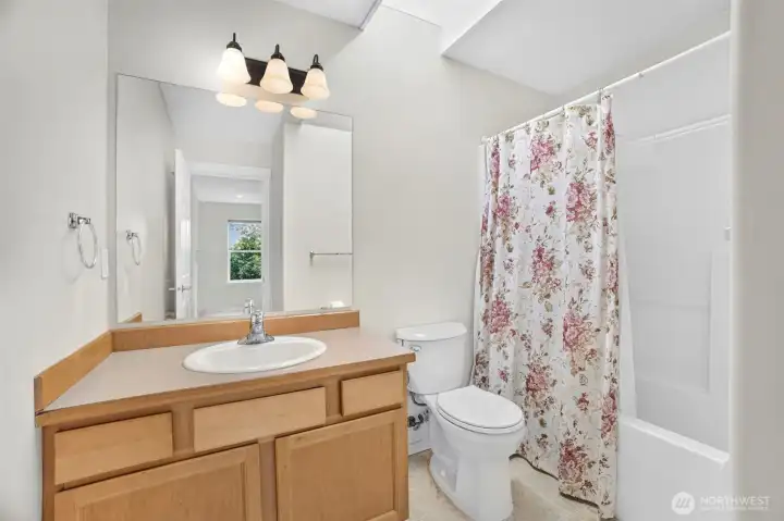 Upstairs full bathroom with skylight. Upstairs full bathroom with skylight.