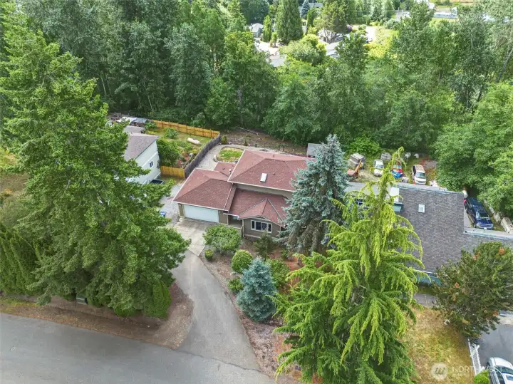 Ariel view of the house showing street view and back greenbelt. Ariel view of the house showing street view and back greenbelt.