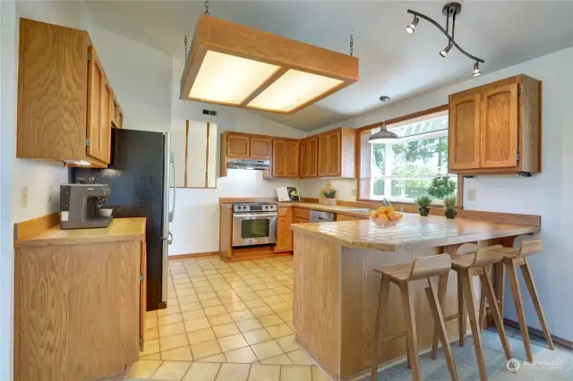 Open kitchen with lots of cabinet and counter space.  Garden window overlooks the peaceful backyard!