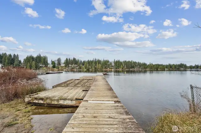 Community lake dock for enjoying fishing, paddle-boarding, and kayaking.