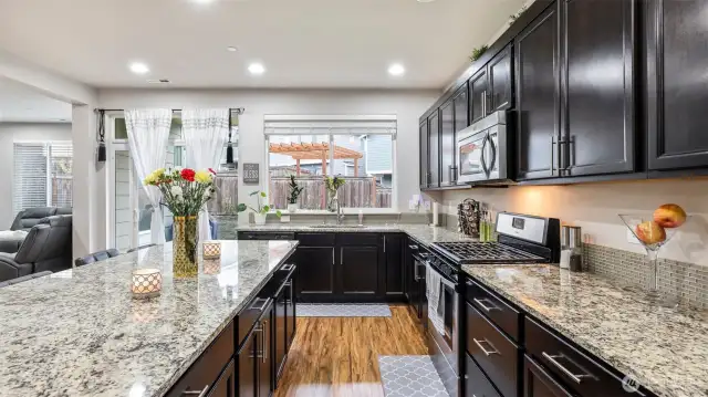 Virtually staged. This kitchen has an abundance of cabinetry.