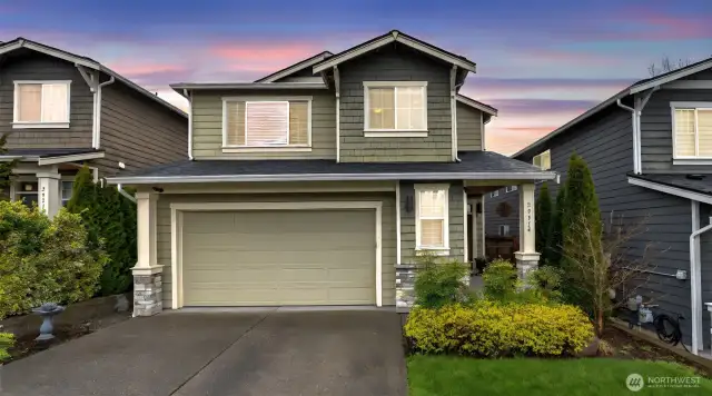 Twilight view of front exterior.