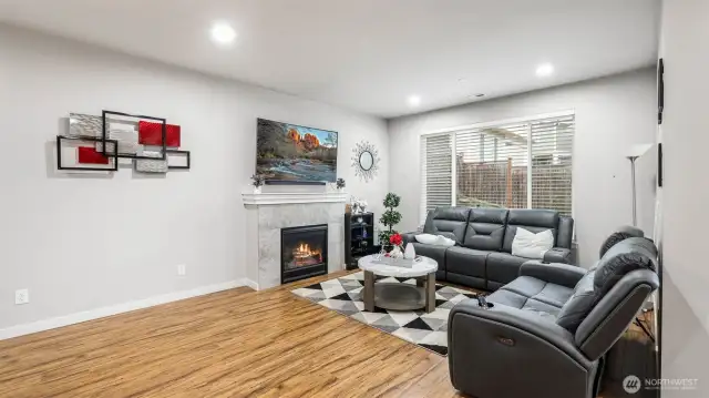 Virtually staged. A striking gas fireplace in the living room invites relaxation.
