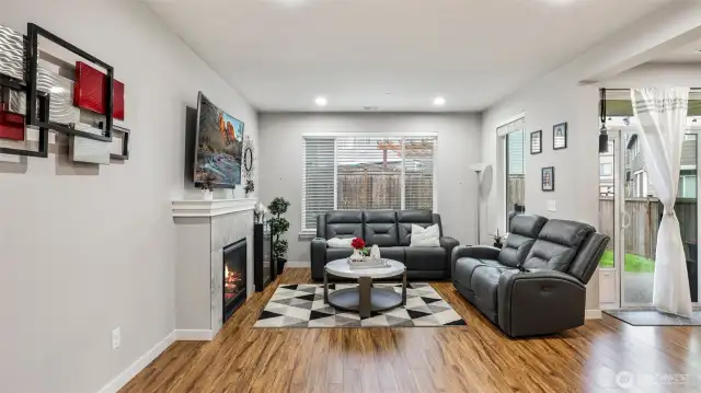 Virtually staged. Relax or entertain in the light-filled living room.