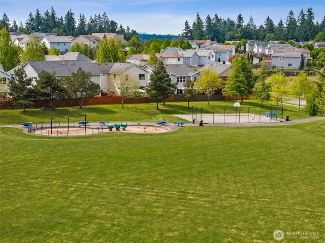 Sports court at Chief Leshi Park and soccer/baseball fields.