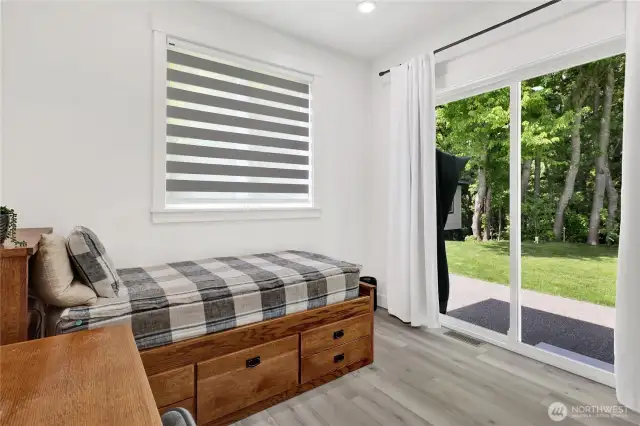 Bonus room on the main floor with sliding door to the back yard