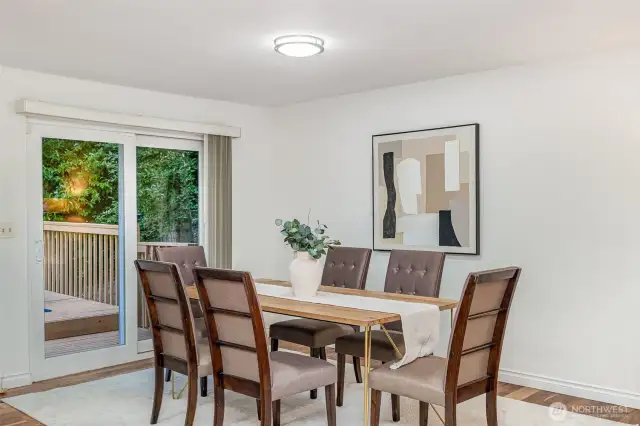 Spacious dining room with room for a large table and deck access