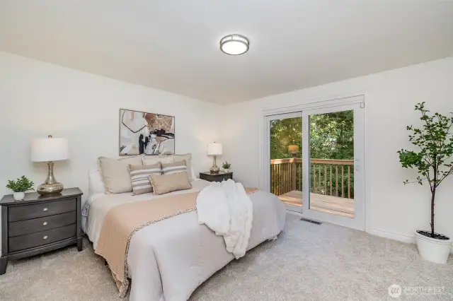 Primary bedroom with direct deck access.
