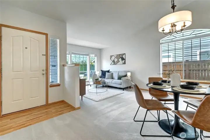 Entry to bright, vaulted, living and dining areas