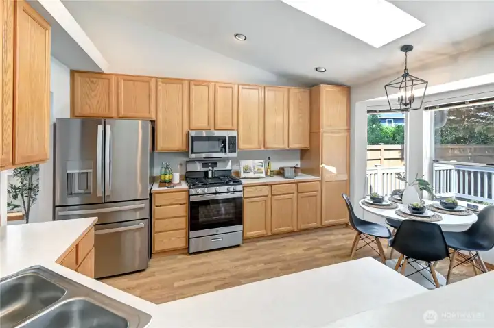 The kitchen's skylight adds to the rooms natural light.