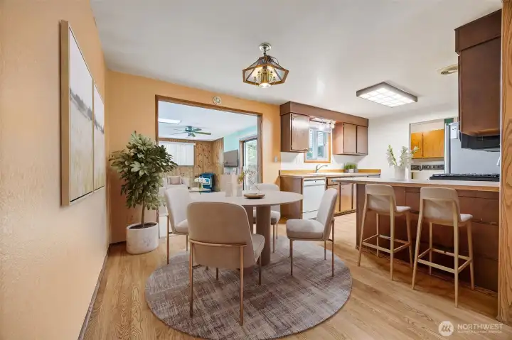 Virtually Staged.Dining space that flows easily to the living room and kitchen, making gatherings effortless.