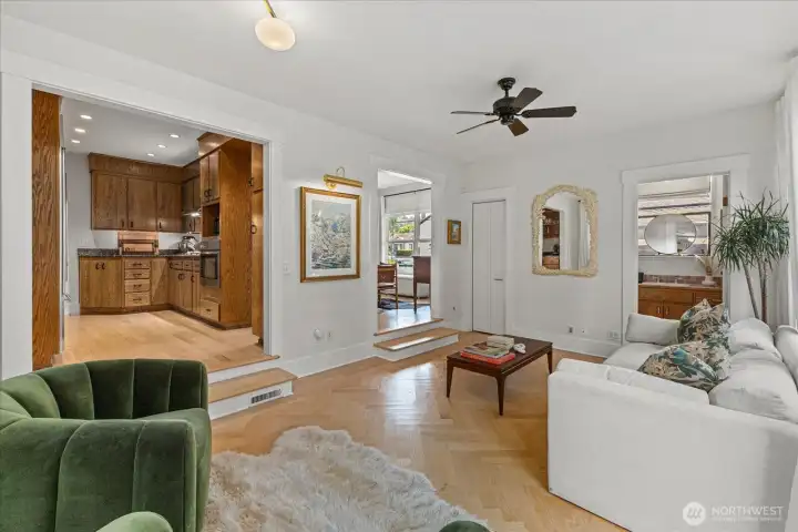 Open yet defined layout connecting kitchen, dining, and living.